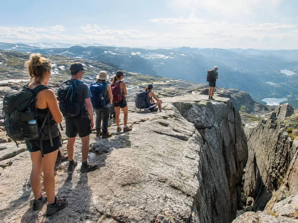 Walkers waiting their turn beside Kjeragbolten on a busy summer afternoon